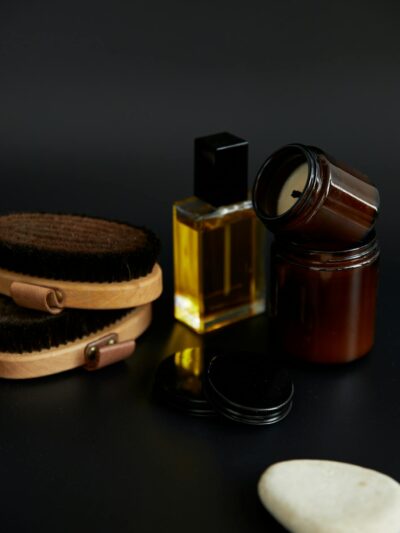 Sophisticated arrangement of bath oils, brushes, and toiletries in a studio still life.